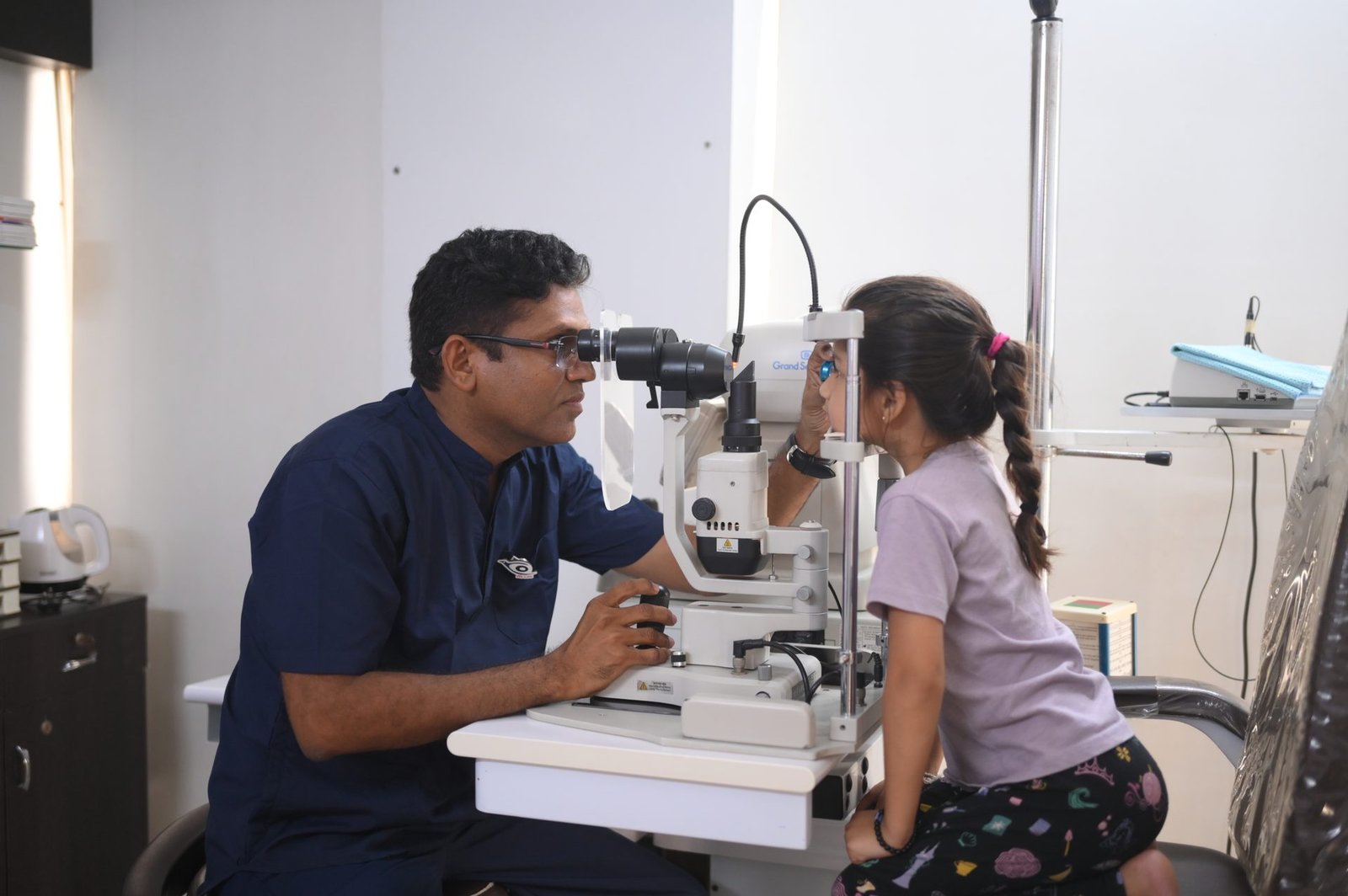 Dr. Ajay Panchal examining a child patient at Vidya Eye Hospital